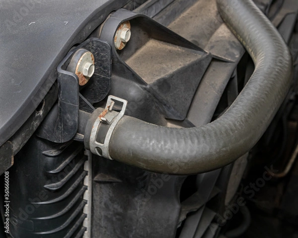 Fototapeta Cooling system radiator hose on car engine. Concept of vehicle service, repair, maintenance and inspection