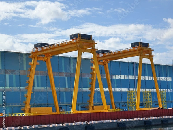 Obraz Two Large Yellow Gantry Cranes