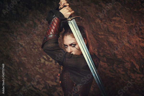 Fototapeta Fighter woman in parrying position with sword