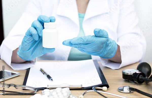 Obraz the doctor is sitting at the desk. Patient reception