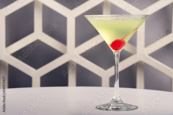Fototapeta Fruit martini on white table with modern design bar background