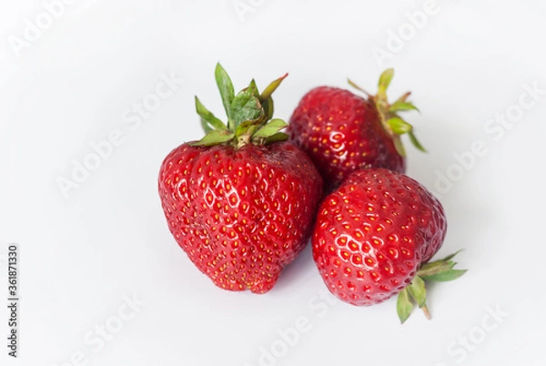 Fototapeta Eco or Bio Strawberry Isolated on White Background - Three Berries Composition Front View Close up Shot with Natural Light