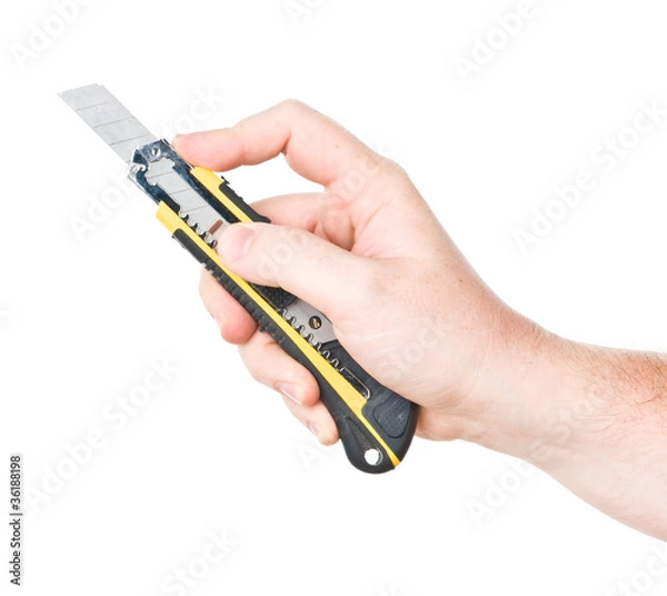 Fototapeta hand with cutter