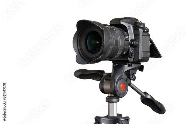 Obraz Digital camera with lens hood on tripod closeup isolated on white background with copy space