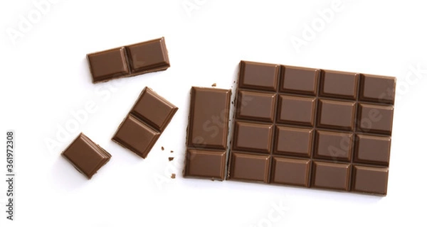 Fototapeta Chocolate pieces isolated on white background from top view