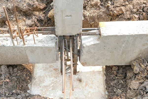 Fototapeta cleanng foundation pillar for making joint concrete for reinforce structure out door site. No people