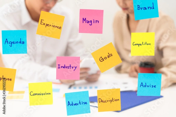 Fototapeta business team planning startup project placing sticky notes session to share idea or brainstorm