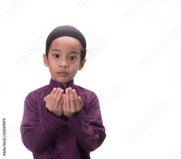 Fototapeta A Muslim kid with various poses isolated over white