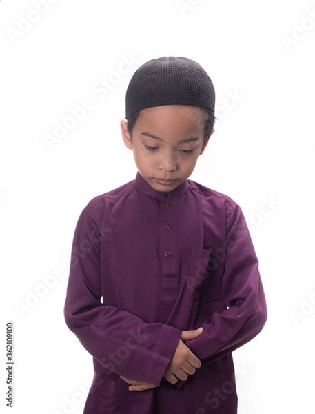Fototapeta A Muslim kid with various poses isolated over white