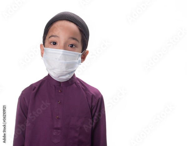Fototapeta A Muslim kid with various poses isolated over white