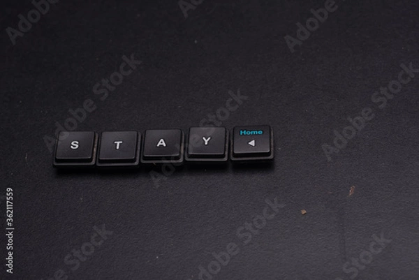 Obraz Stay at home message isolated over dark background, high angle shot