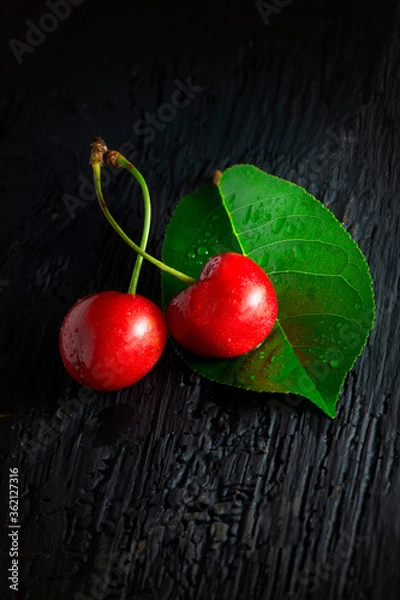 Fototapeta cherry on a wooden background red food