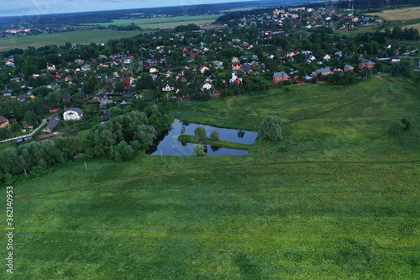 Fototapeta amazingly beautiful nature with a river at dawn taken from a drone