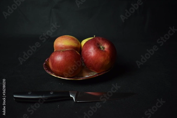 Fototapeta Still life in low key with black background.