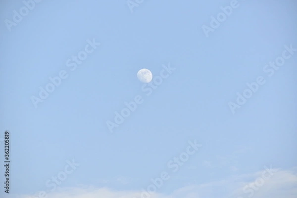 Obraz Moon and cloud on blue sky.