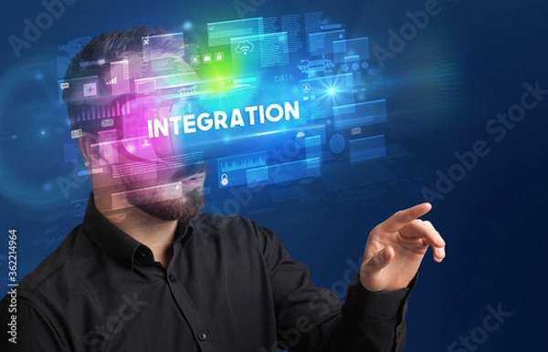 Fototapeta Businessman looking through Virtual Reality glasses with INTEGRATION inscription, innovative security concept