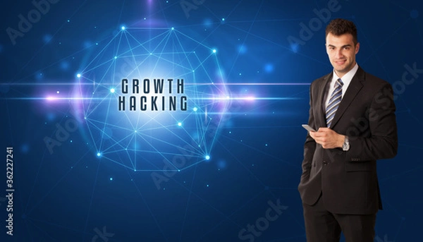 Fototapeta Businessman thinking about security solutions with GROWTH HACKING inscription
