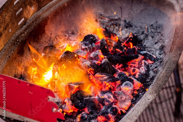Obraz close up burning coals in a barbeque stand