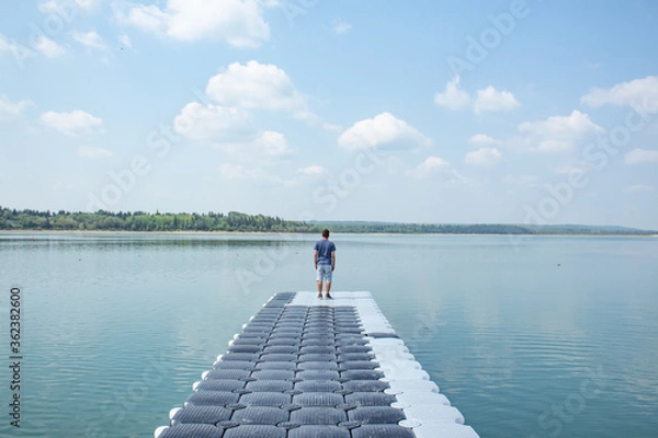Obraz Man walking into the water