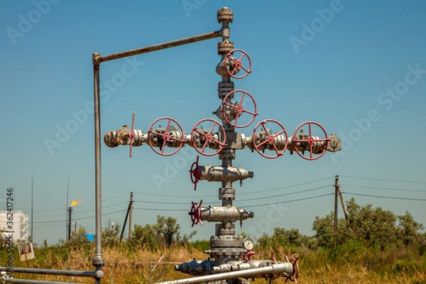 Fototapeta Oil field scene, oil pipelines and facilities