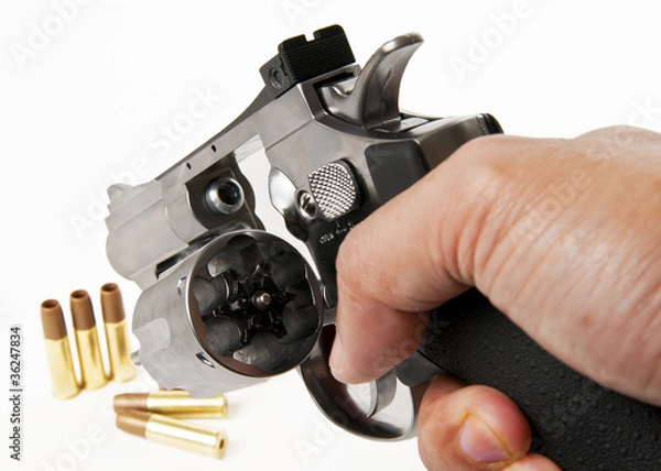 Fototapeta empty socket of revolver isolated on white background