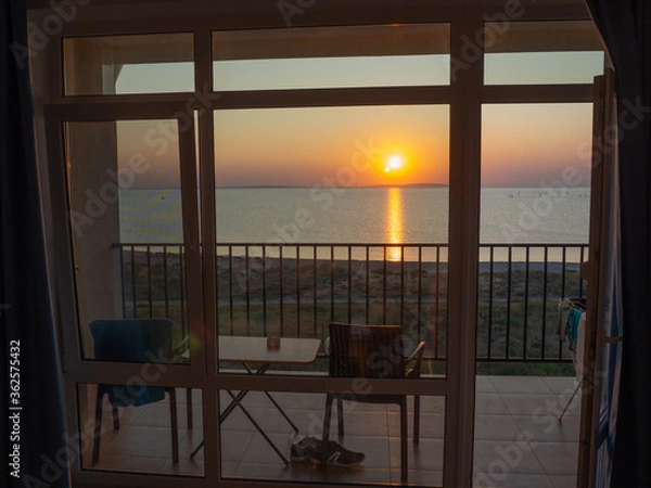 Obraz sea view from a hotel room with two chairs and a table
