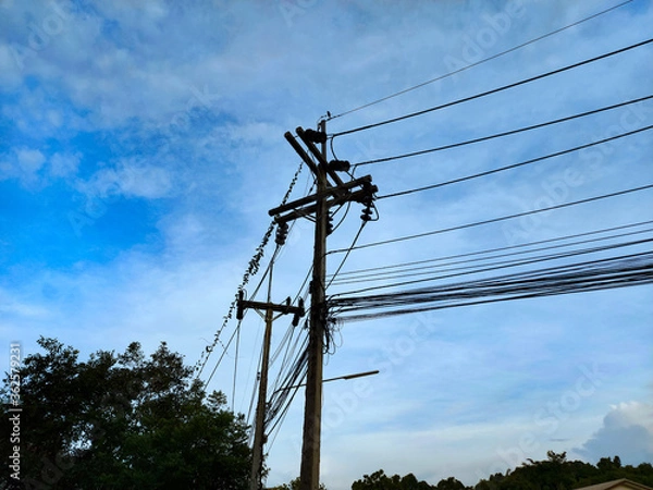 Fototapeta electric pole with blue sky background