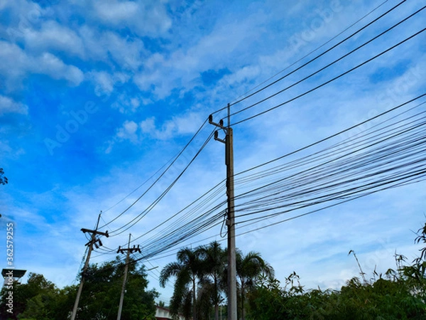 Fototapeta electric pole with blue sky background