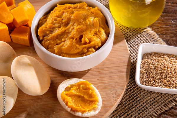 Obraz Pumpkin puree or hummus on a rustic wooden table. Selective focus