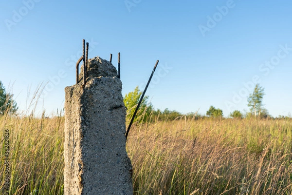 Obraz broken concrete power line pole