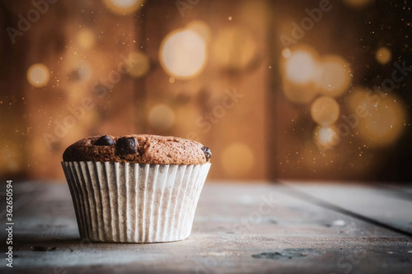 Obraz Chocolate muffin with bokeh background