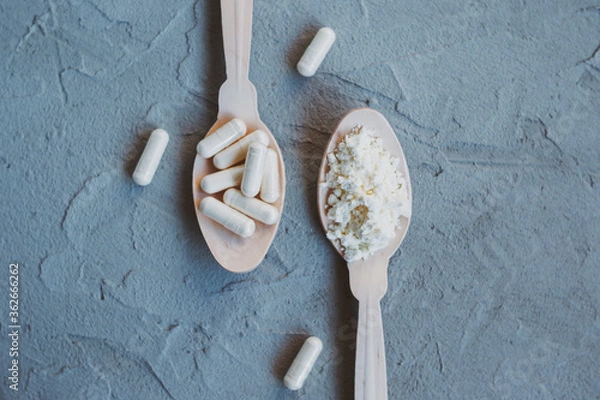 Obraz Collagen or colostrum in capsules and powder