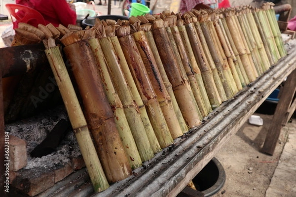 Obraz Khao Lam Local food of Thailand. Cook rice with bamboo tubes.