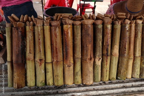 Obraz Khao Lam Local food of Thailand. Cook rice with bamboo tubes.