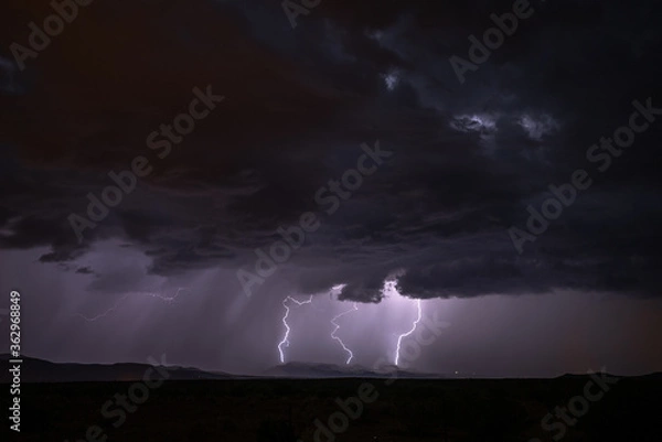 Fototapeta A lightning producing monsoonal storm.