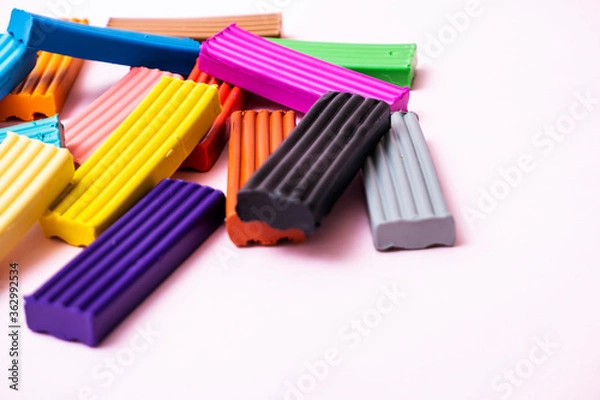Fototapeta Plates of multi-colored plasticine. Photo of plasticine on a pink background.