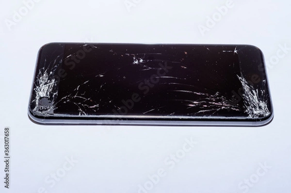 Fototapeta View on a cracked screen of a smartphone