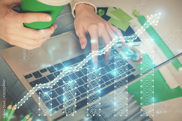 Fototapeta Double exposure of woman hands typing on computer and forex chart hologram drawing. Stock market invest concept.