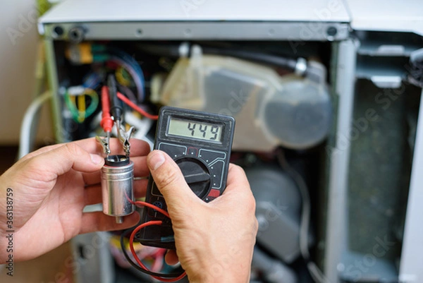 Fototapeta resistance measurement on the starting capacitor when repairing a dishwasher