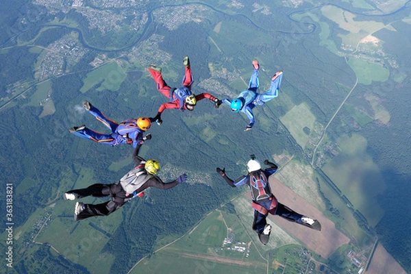Fototapeta Skydiving. Skydivers are training and flying in the sky.