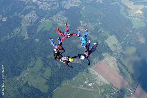 Fototapeta Skydiving. Skydivers are training and flying in the sky.