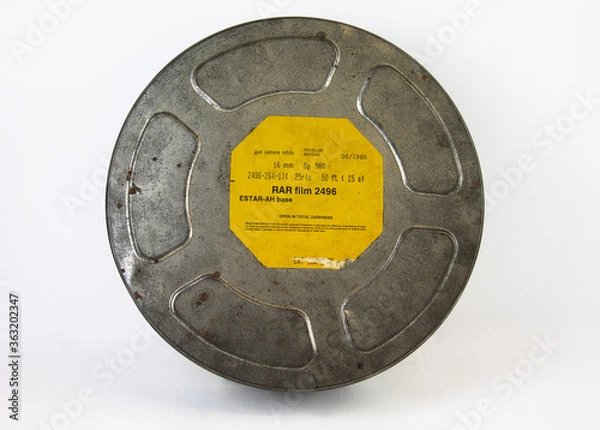 Obraz An original old film can with an orange label. For 16 mm film rolls.