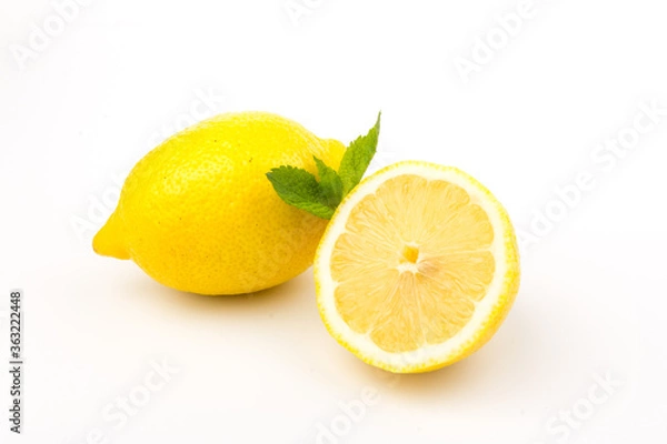 Fototapeta Group of lemons with mint leaves, isolated on white background