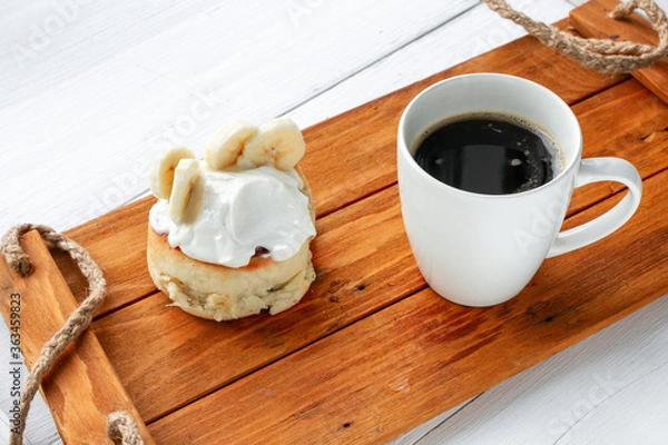 Fototapeta synabon on a wooden tray with a cup of coffee