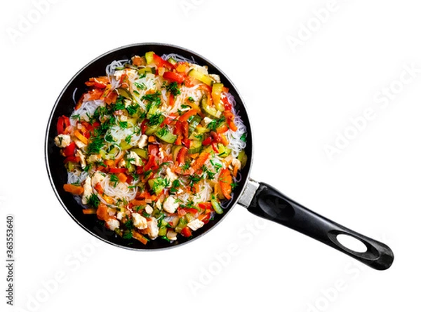 Fototapeta fungoza salad cellophane rice and delicious tasty vegetables red bell pepper carrots cucumber dill greens tomato onion shredded fried chicken meat in a pan with a handle together on a white background