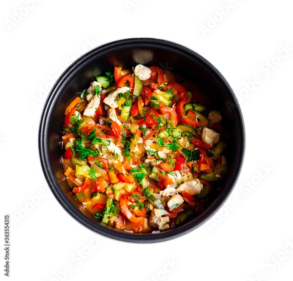 Fototapeta mouth-watering tasty vegetables red bell pepper carrots cucumber dill greens tomato onion shredded fried chicken meat in a pan together on a white background top view