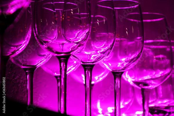 Fototapeta 12 Wine glasses and glasses on a shelf in a bar