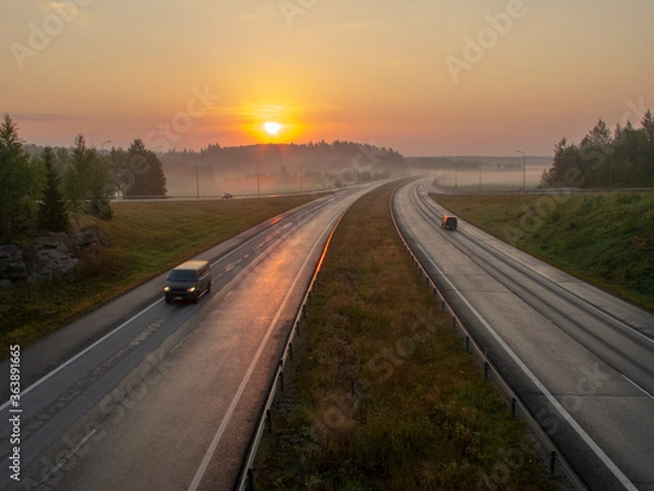 Fototapeta Highway in Finland at sunrise