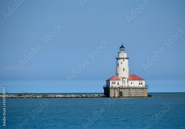 Fototapeta The Chicago Harbor Lighthouse stands at the south end of the northern breakwater protecting the Chicago Harbor, to the east of Navy Pier and the mouth of the Chicago River.