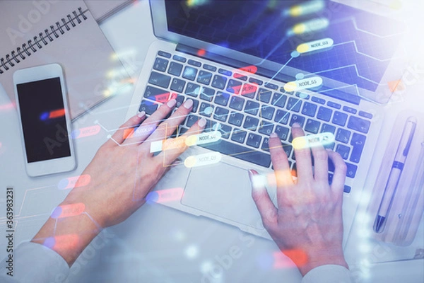 Fototapeta Double exposure of woman hands working on computer and data theme hologram drawing. Top View. Technology concept.